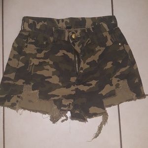 Green distressed camo shorts